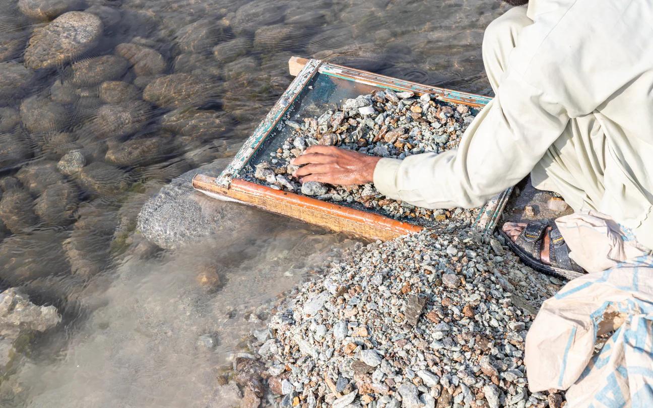 Swat Emerald - Man washing gravel in search of emerald
